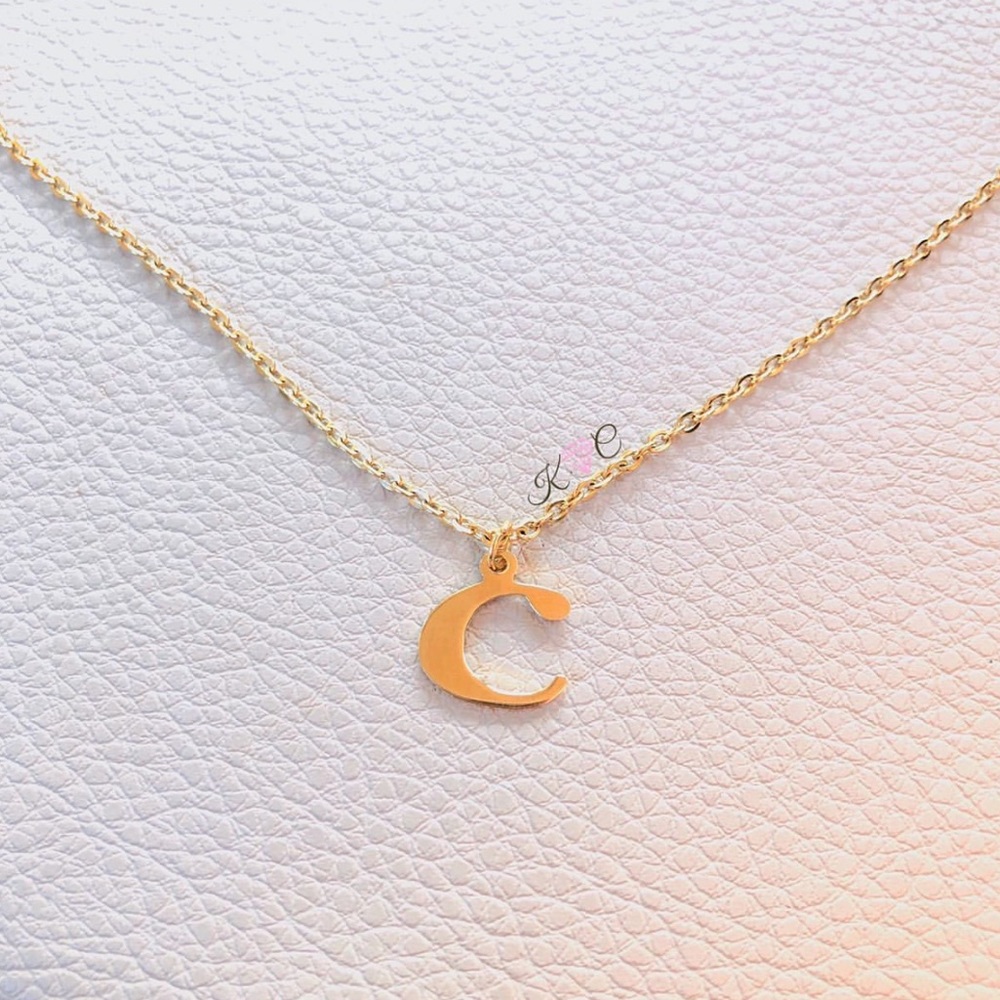 Lower case “c” necklace